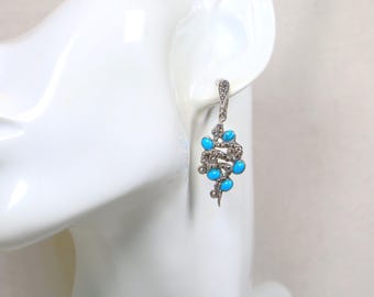 Orecchini pendenti a forma di serpente in argento sterling con turchese e marcasite.