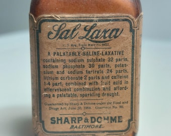 May include: A brown glass bottle with a label that reads "Sal Laxa" and lists the ingredients of a saline laxative. The label also includes the company name "Sharp & Dohme" and the city "Baltimore".