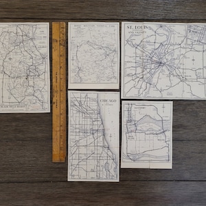 Pequenos pedaços de mapa de papel vintage Região de Black Hills Parque Nacional das Montanhas Rochosas St Louis Chicago Quad Cities