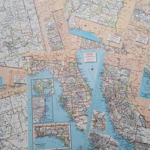 May include: A collection of vintage maps of the United States, including Arizona, New Hampshire, Vermont, Florida, Alabama, Georgia, Minnesota, and California. The maps are printed on paper and have a faded, antique look.