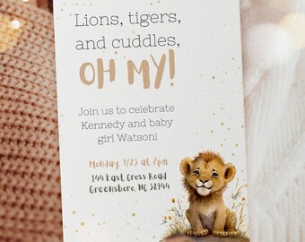 May include: A baby shower invitation with a cute lion cub illustration. The invitation reads "Lions, tigers, and cuddles, OH MY!" and includes the details for the event: "Join us to celebrate Kennedy and baby girl Watson! Monday, 9/23 at 2pm 144 East Cross Road Greensboro, NC 38944"