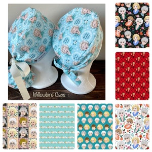 May include: Two blue and white patterned surgical caps with the text "Thank you for being a friend" and a floral design.  The caps are on white mannequins.  There are six different fabric patterns with images of the Golden Girls.