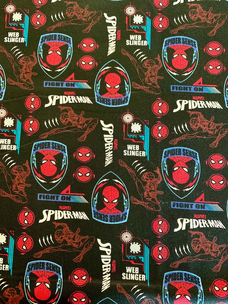 May include: Black fabric with a repeating pattern of red and blue Spider-Man characters. The pattern includes the words "Spider Sense", "Fight On", "Marvel", and "Spider-Man".