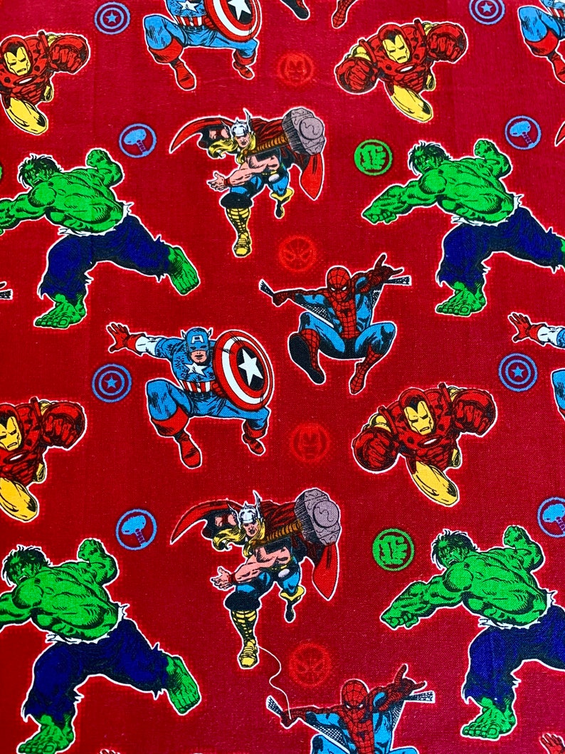May include: Red fabric with a repeating pattern of various Marvel superheroes, including Iron Man, Captain America, Thor, Hulk, and Spider-Man. The superheroes are depicted in their classic comic book style.