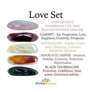 May include: A Love Set collection featuring five polished stones: a pale pink rose quartz, a deep red garnet, a creamy white moonstone, a multi-colored mookaite jasper with orange and red tones, and a dark black tourmaline, with descriptive text.