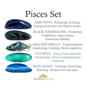 May include: A Pisces Set collection featuring five polished stones: a dark purple amethyst, a black tourmaline, an iridescent abalone shell, a bright green fluorite, and a translucent blue agate. Each stone is labeled with its name and properties.