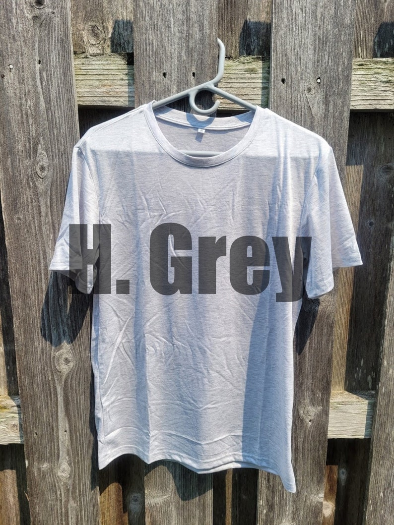 May include: A light gray t-shirt with the text "H. Grey" printed in black on the front.
