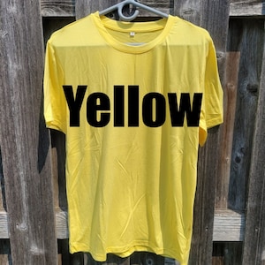 May include: A yellow t-shirt with the word "Yellow" printed in black on the front.