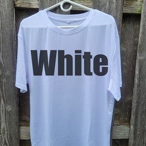 May include: White t-shirt with the word "White" printed in black on the front.