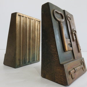 Pair of Mid Century Modern Metal Clad Bookends with Key Motif