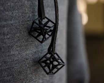 Necklace made of 2 3D printed geometric cubes connected by a long eco leather rope; you can wear it layered, architecture science math gift