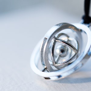 3d printed silver geometric pendant necklace with kinetic mechanism & rotating spinner, turner; gift for science teacher or architect, time