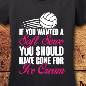 May include: Black t-shirt with a white volleyball graphic and pink text that reads "If you wanted a Soft Serve You Should Have Gone For Ice Cream".