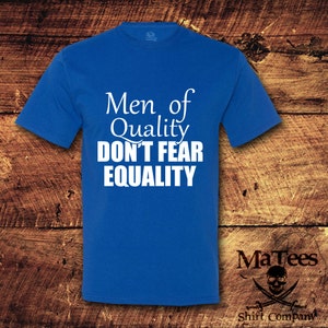 May include: A royal blue t-shirt with white text that reads "Men of Quality Don't Fear Equality".
