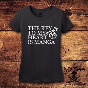 May include: A dark gray t-shirt with a white graphic of a key and a heart lock with the text "The key to my heart is manga".