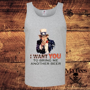 May include: A grey tank top featuring a vintage-style image of Uncle Sam pointing and the text "I WANT YOU TO BRING ME ANOTHER BEER". The image has a distressed and faded look. The tank top has a white collar and is made of a soft, comfortable material.