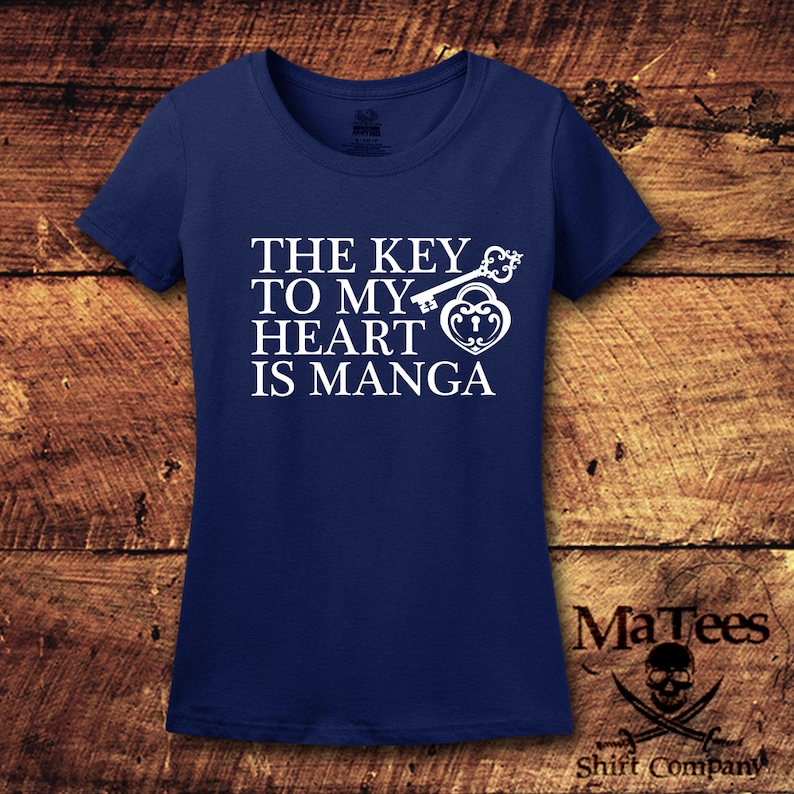 May include: A navy blue t-shirt with white text that reads "The key to my heart is manga" and a graphic of a key and padlock.