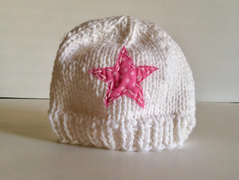 Hand Knit child\u2019s pink and white star hat