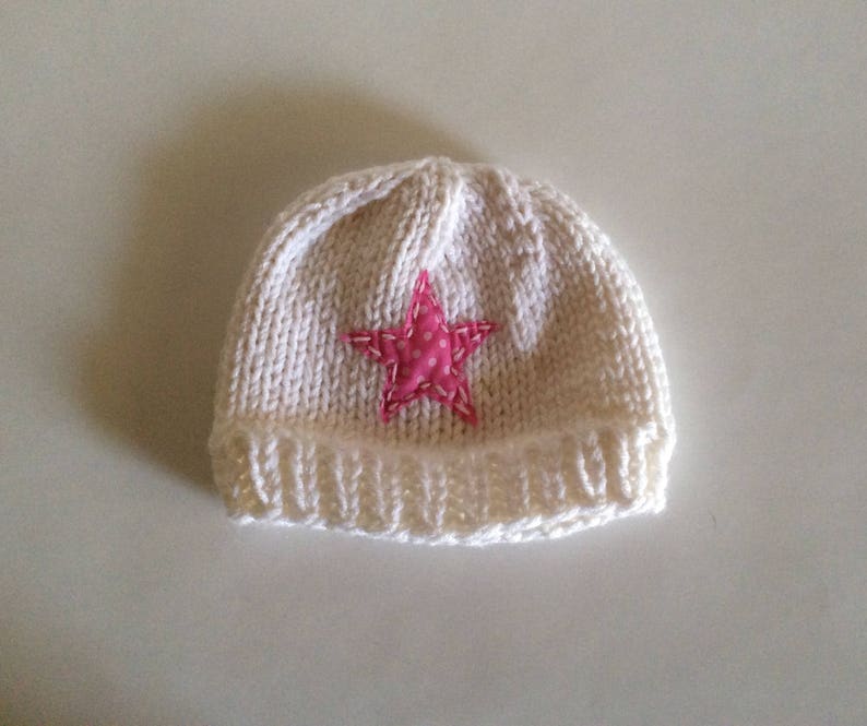 Hand Knit child\u2019s pink and white star hat