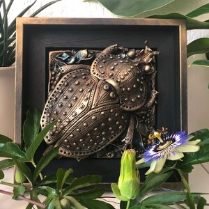 Beetle relief with a wooden frame, home decoration, Bronze beetle made of polymer clay, stylized animal