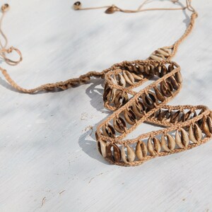 Handmade woven beige shell tie belt.