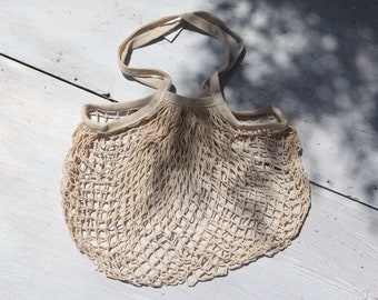 Organic cotton beige mesh-net market shopping handle bag.