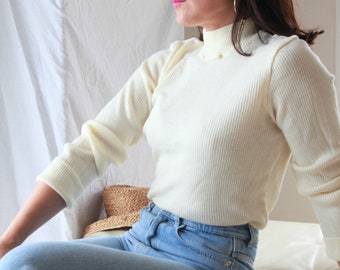 cream colored mock turtleneck
