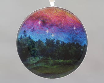 Dancing Sky  - Glow-in-the-dark pendant with a surreal image of trees