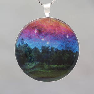 Dancing Sky Glow-in-the-dark pendant with a surreal image of trees image 1