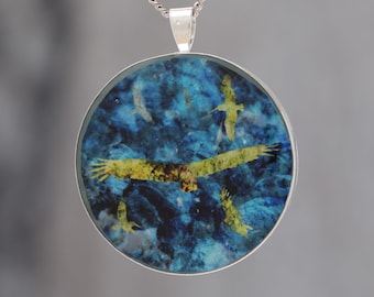 Flying by the Seaside  - Glow-in-the-dark pendant with a beautiful abstract bird pattern