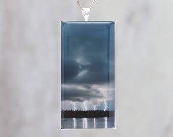 Glowing Lightning! Glow in the dark pendant featuring dramatic storm clouds and 4 bolts of lightning - B3