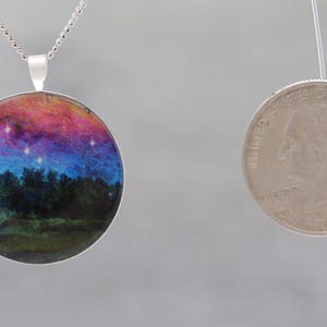 Dancing Sky Glow-in-the-dark pendant with a surreal image of trees image 5