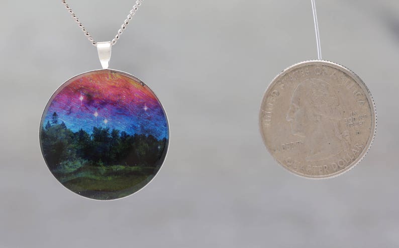 Dancing Sky Glow-in-the-dark pendant with a surreal image of trees image 5