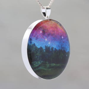 Dancing Sky Glow-in-the-dark pendant with a surreal image of trees image 3