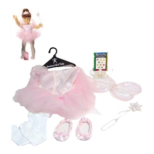 May include: A pink ballet outfit for an American Girl doll, including a tutu, leotard, ballet shoes, tights, fairy wings, and a wand. The outfit is displayed with a doll wearing the costume and a hanger that says "American Girl of Today".