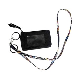 May include: Black ID card holder with a clear window and a patterned lanyard. The lanyard features a colorful floral design. The holder has a zipper closure and a key ring attachment. The brand name "Vera Bradley" is printed on a black tag.
