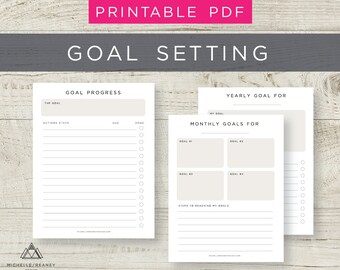 May include: Printable goal setting worksheets with sections for yearly goals, monthly goals, and goal progress. The worksheets have sections for writing down goals, action steps, due dates, and checkboxes for marking tasks as done.
