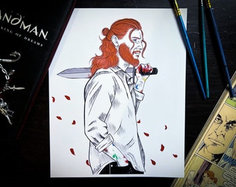 May include: An illustration of a person with red hair and a beard, holding a sword. The person is wearing a white shirt with paint on the sleeves. The image is surrounded by a book, paintbrushes, and comic book panels.