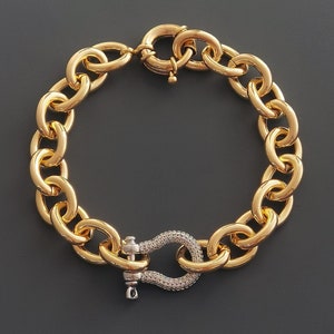 Pulseira com pingente de ferradura em pavê bicolor