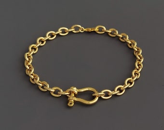 Chunky Gold Tone U Shackle Bracelet: Horseshoe Charm