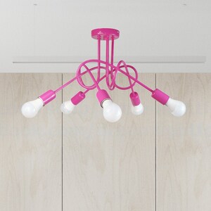 May include: A pink ceiling light fixture with five bulbs. The light fixture has a modern, abstract design with curved arms.