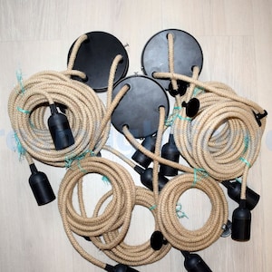 May include: A set of six black electrical cord ends with natural jute rope covered cords. The cords are bundled together and ready to be installed.