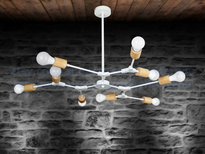 May include: White modern chandelier with wooden accents and eight light bulbs. The chandelier has a simple design with straight lines and a central hub.