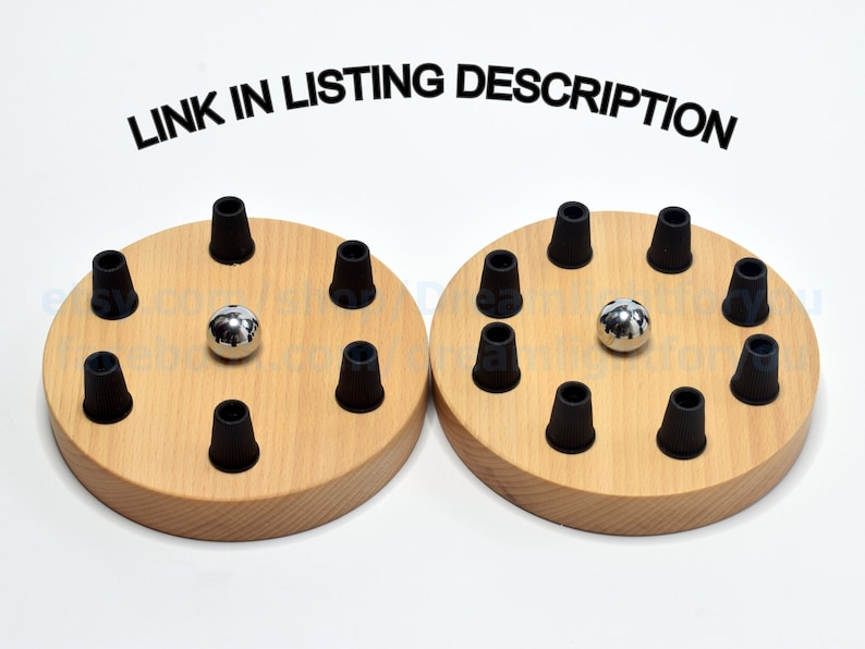 May include: Two wooden bases with black rubber grommets and a silver ball in the center of each. The bases are labeled "LINK IN LISTING DESCRIPTION".