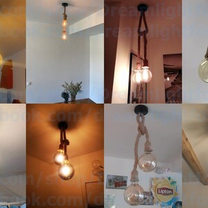 May include: A ceiling pendant light fitting featuring two thick, natural-coloured twisted rope cords suspended from a single black circular mount. Each rope cord holds a clear, round Edison-style light bulb that emits a warm, glowing light.