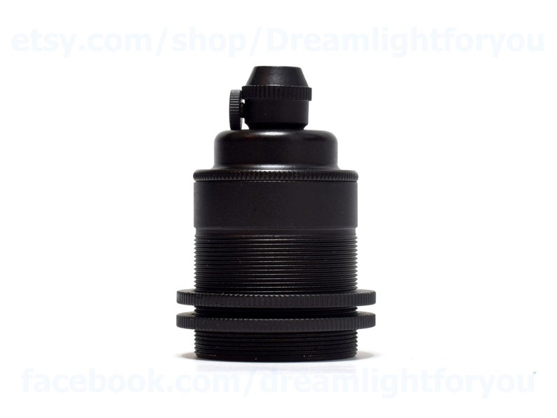 May include: Black metal light bulb socket with a threaded base and a screw-on cap.