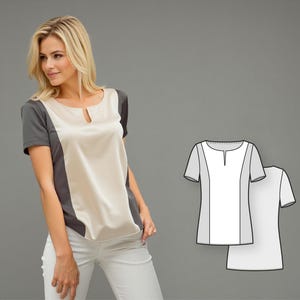May include: A short-sleeved blouse with a keyhole neckline. The top features a cream-colored front panel, flanked by gray side panels. The woman is wearing white pants. A pattern of the blouse is shown on the right.