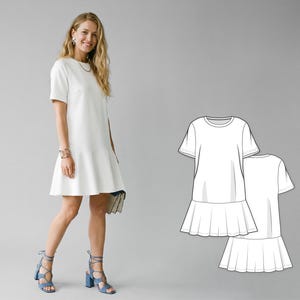 May include: A white, short-sleeved dress with a flared skirt, paired with blue heeled sandals. The dress has a simple, elegant design. A line drawing of the dress is also shown. The model is smiling and holding a clutch.
