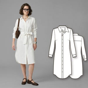 May include: A white shirt dress with long sleeves, a button-down front, and a tie belt. The dress is knee-length and worn with brown shoes and a brown purse. A line drawing of the dress is also shown.