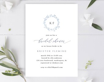 May include: A blue and white floral wreath with the initials "KF" in the center. The text "join us for a bridal shower as we honor bride to be KRISTEN FLEMING march 19th at 11:00 a.m. hosted by ella andersen 124 rose boulevard, washington, de registered at theknot.com rsvp to ella77@gmail.com PUMPKIN PI DESIGN" is printed below the wreath.